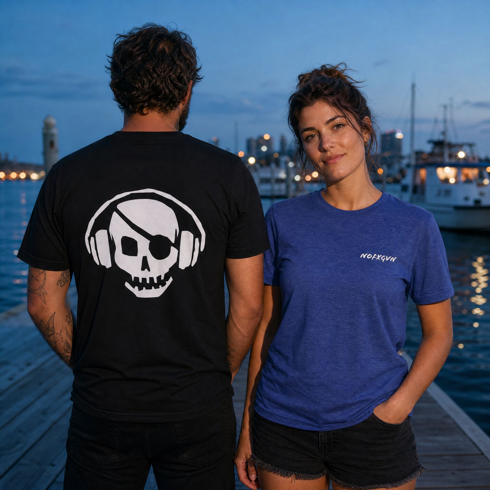 Unisex Skull & Headphones tee front and back - man in Black showing the back print, woman in Heather True Royal showing the front logo | NOFXGVN